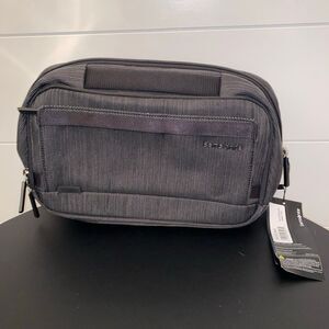 Samsonite Convertible sling bag-Adjustable/removeable strap. 4 Zip storage areas